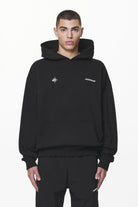 Pegador Gien Oversized Hoodie Black Seitenansicht aus der Do not Disturb Kollektion für Herren