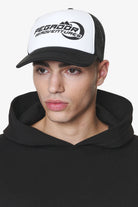 Pegador Eazor Trucker Cap Black White Hauptansicht aus der Do not Disturb Kollektion für Herren