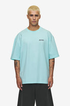 Pegador Patino Oversized Tee Washed Sky Blue Seitenansicht aus der High summer Kollektion für Herren