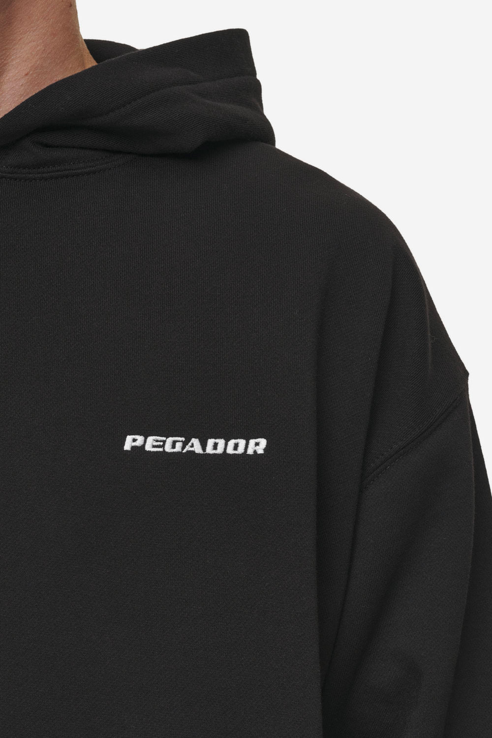 Pegador Logo Oversized Hoodie Washed Black Detailshot aus der Most Alive Kollektion für Herren