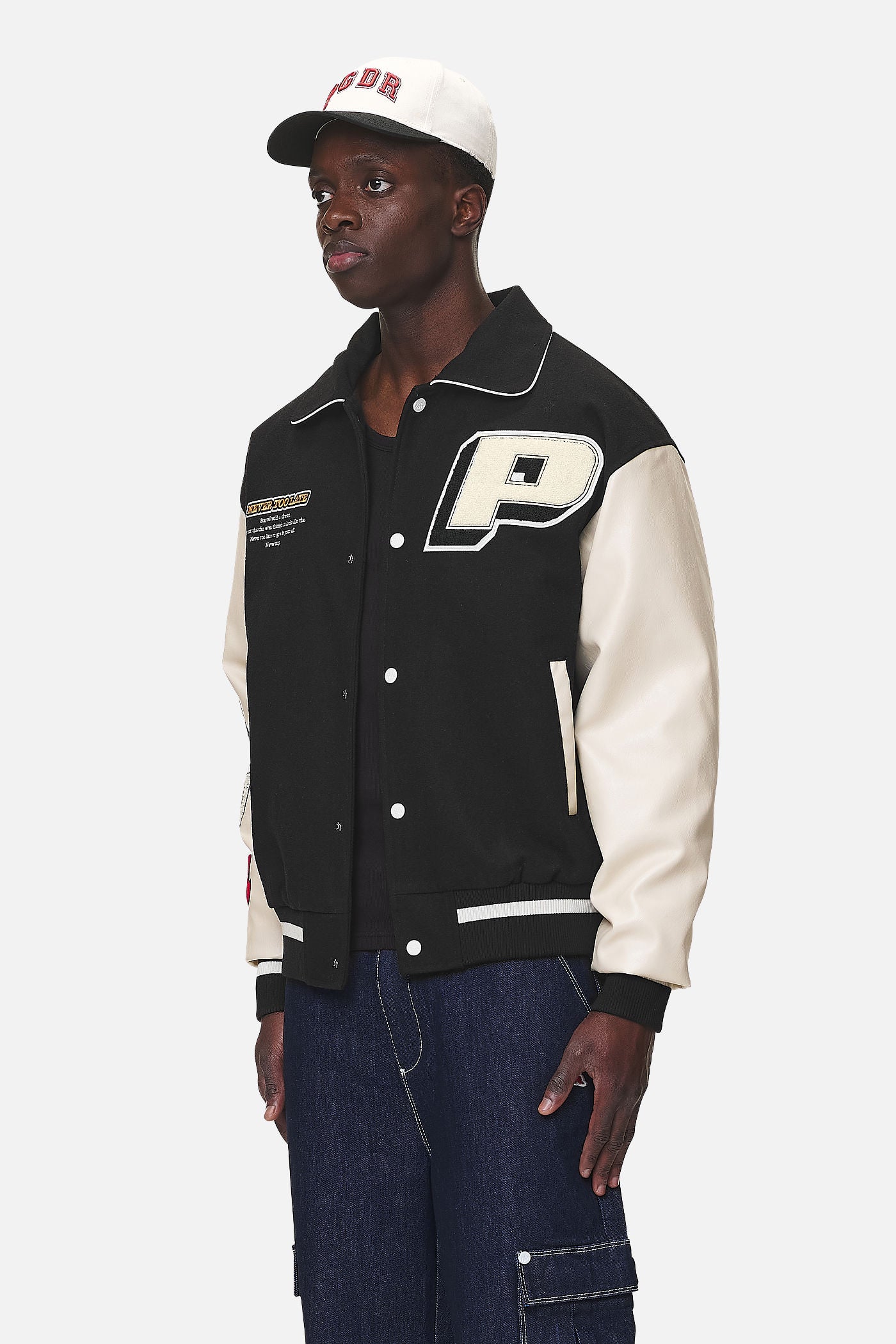 Pegador Oris Varsity Jacket Black Cream Gegenansicht aus der Never Too Late Kollektion für Herren