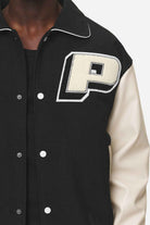 Pegador Oris Varsity Jacket Black Cream Detailshot aus der Never Too Late Kollektion für Herren