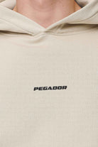 Pegador Logo Boxy Hoodie Washed Desert Sand Black Gum Detailshot aus der Never Too Late Kollektion für Herren