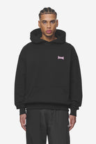 Pegador Dacko Oversized Hoodie Washed Black Bubblegum Seitenansicht aus der Next Wave Kollektion für Herren