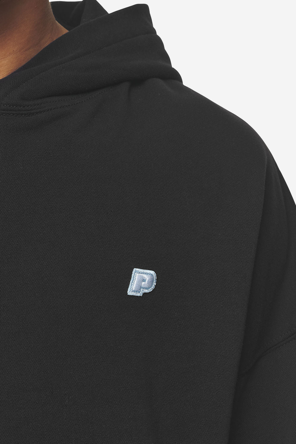 Pegador Leono Boxy Hoodie Washed Black Baby Blue Detailshot aus der Next Wave Kollektion für Herren