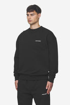 Pegador Logo Oversized Sweater Washed Black White Gum Seitenansicht aus der Next Wave Kollektion für Herren